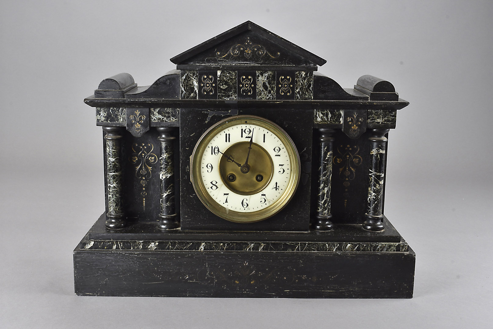 A 19th century black slate mantle clock, the Arabic dial flanked by marble columns 45 cm W