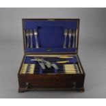 A 1930s oak cased part canteen of flatware, together with a Persian copper incense burner, and a