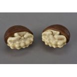 A pair of Meiji period carved ivory and boxwood Okimono, each with a threaded hole beneath, each 4.5
