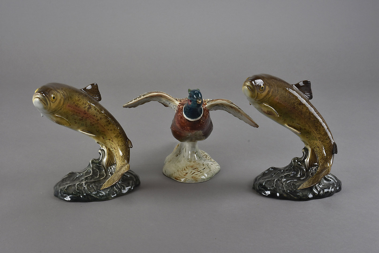 Two Beswick leaping trout fish groups, model number 1032, plus a Beswick pheasant model number 850