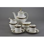 A Royal Doulton coffee set, comprising six cups and saucers, coffee pot, sugar bowl and milk jug (