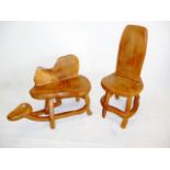 Two late 20th century elm chairs, each carved from one solid piece of wood (2)