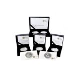 A collection of Eight Royal Mint silver proof coins, including three Britannia one ounce two pounds,