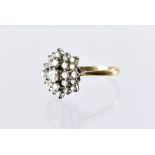 A 1970s 18ct gold and diamond cluster cocktail dress ring, platinum claws set with brilliant cuts,