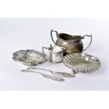 A Victorian silver shell shaped butter dish and knife, together with a silver sugar basin, a