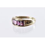 A modern 9ct gold and five stone ring, five purple garnets in channel setting, 4g and size R 1/2