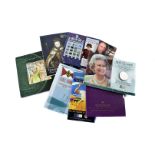 A collection of modern Royal Mint and others proof coin and coin and stamp sets, mostly opened,