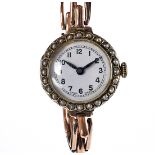 An early 20th century 9ct gold Buren ladies wristwatch, having pearl bezel, on a 9ct gold