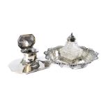 A Victorian silver and glass inkwell from F.B Ltd, circular with shaped and embossed rim and