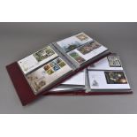 Eight albums of Royal Mail GB First Day Covers, dating from the 1960s through to 2010, six maroon