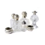 A pair of late 19th century silver and hobnail cut glass perfume bottles, together with a