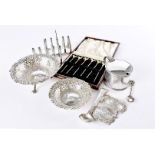 A collection of Victorian and later silver, including two cased sets of six cocktail sticks with