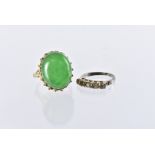 A 1970s Chinese hardstone cocktail dress ring, the yellow metal mount with a large green jadeite