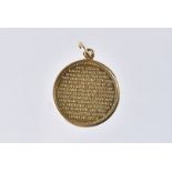 A modern 9ct gold pendant, circular with Lord's Prayer to reverse, 2g