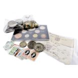 A small collection of British coins and stamps, including a vacant Victory and Peace album, three