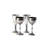 A set of 18 1970s silver plated wine goblets, along with one broken example, together with a pair of