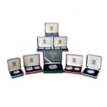 A collection of thirteen Royal Mint silver proof coins, including a Queen Mother centenary