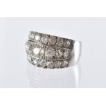 An impressive modern diamond cocktail dress ring, the 18ct white gold mount having three rows of old