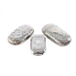 Three Victorian and later silver vesta cases, oval form, two larger, each with engraved designs (3)