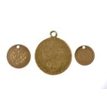 A George III spade guinea and two small gold coins, the guinea very worn, with applied pendant loop,