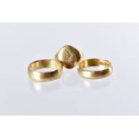Three Victorian and later 18ct gold rings, including two wedding bands and a family crest signet