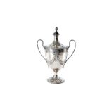 A fine George III silver trophy cup and cover by William Holmes, the twin loop ear shaped handles on