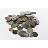 A collection of British coins, including some dug up examples such as a badly damaged Victorian