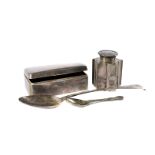 An Edwardian silver tea caddy, together with a George III silver basting spoon, a George V silver