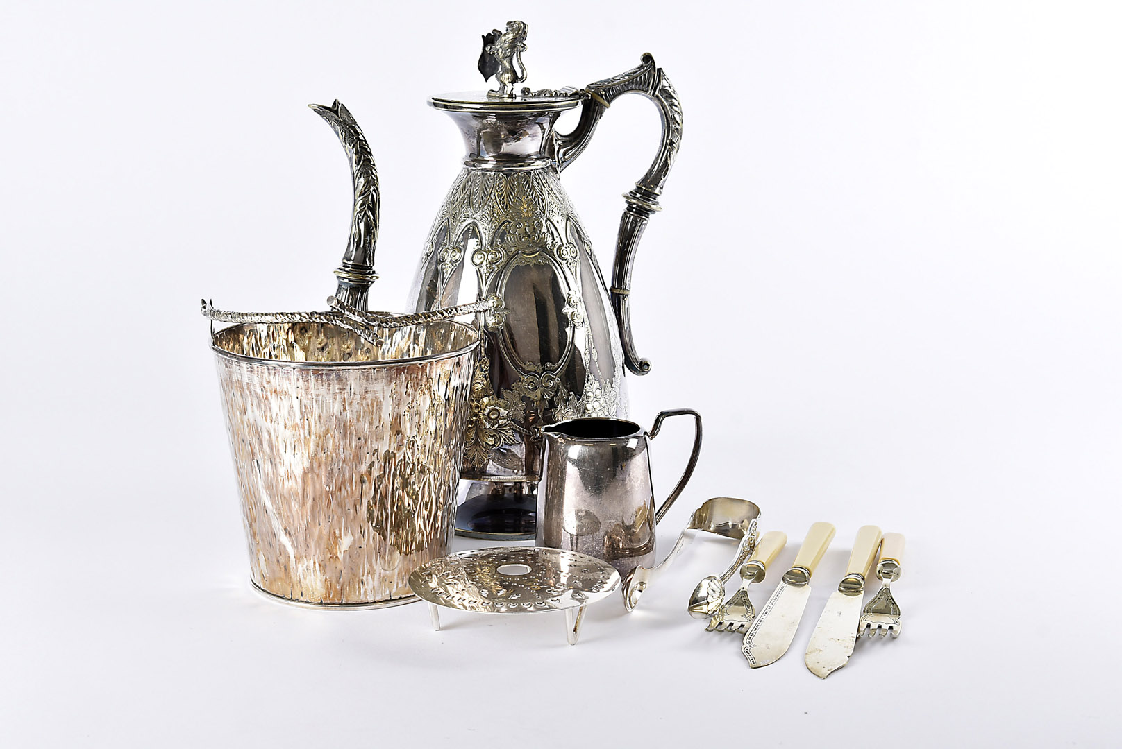 An Edwardian silver plated ice bucket by Hukin & Heath, together with a collection of silver