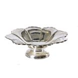 A George V silver footed dish by HA, flower head style upper on circular spreading foot, 13 ozt