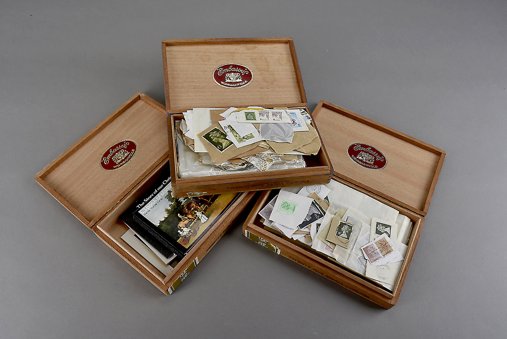 A collection of 20th century British stamps, some loose in cigar boxes and other boxes, including