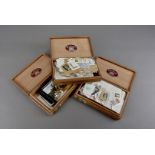 A collection of 20th century British stamps, some loose in cigar boxes and other boxes, including