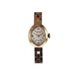 A 1960s 9ct gold Smiths lady's wristwatch, oval case with integrated rectangular link bracelet, 21g