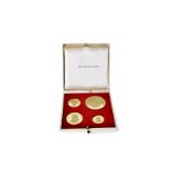 A 1960s set of four 18ct gold commemorative medallions, in fitted Metal Imports case, celebrating