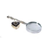 An Edwardian silver handled magnifying glass, together with a small modern silver heart shaped