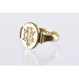 A Victorian 18ct gold signet ring, with monogram tablet, 7.5g and size R
