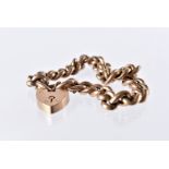 A Victorian period yellow metal bracelet, curb link chain united by a heart shaped padlock clasp,