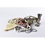 A collection of costume jewellery and other items, including bead necklaces, brooches, and more, a