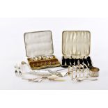 An Art Deco period silver toast rack, together with a set of silver Apostle teaspoons and matching