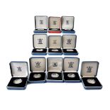 A collection of eighteen Royal Mint silver proof one pound coins, from the 1980s and predominantly