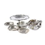 A collection of Peruvian silver and silver plated items, including a pair of coin ashtrays, a larger