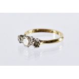 A modern 18ct gold and three stone diamond engagement ring, brilliant cuts totalling approx 0.