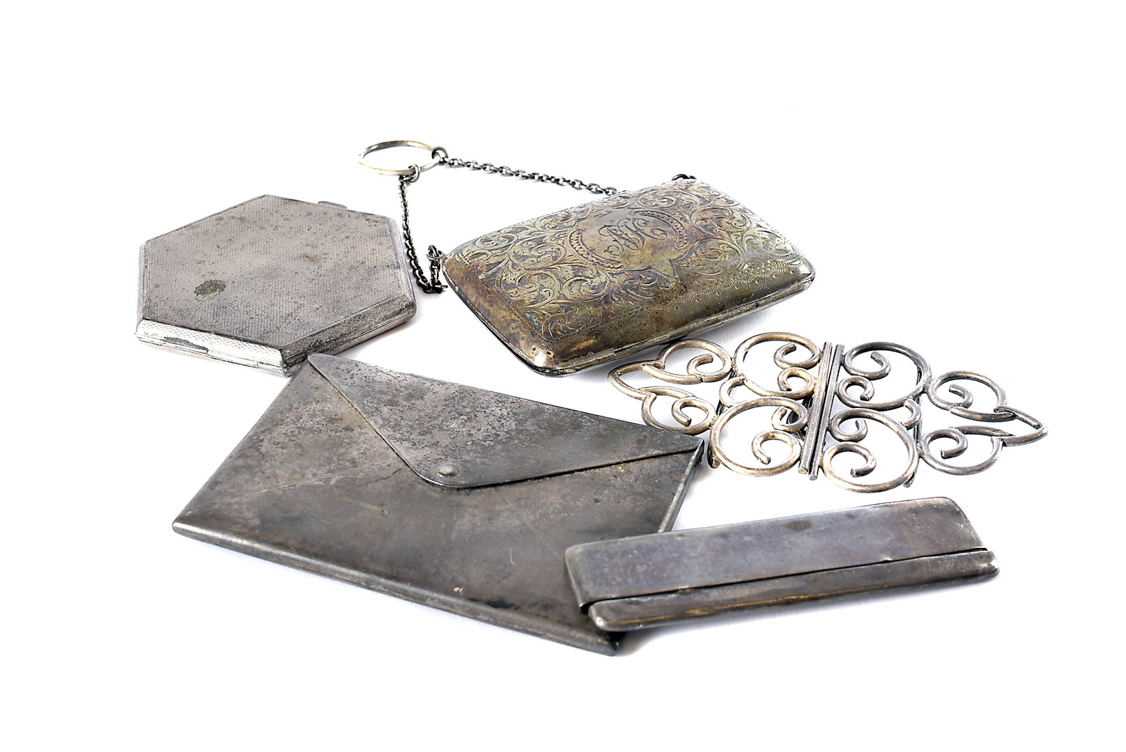 Five Victorian and later items of ladies silver, including an envelope shaped calling card case, a