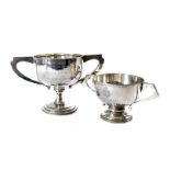 Two silver presentation twin handled trophies, one dating from the 1920s called the Challenge Cup,