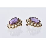 A pair of modern 9ct gold and amethyst earrings, the cluster style mounts with central purple