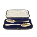 A pair of cased George II silver tablespoons, the Victorian fitted case marked Date 1743, housing