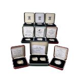 A collection of fourteen Royal Mint silver proof two pound coins, all boxed, two pairs, mainly