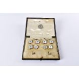 A fine Art Deco period dress stud and cufflink set, the octagonal platinum and mother of pearl