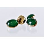 A pair of Edwardian 9ct gold and jade cufflinks, cabochon green hardstones in oval mounts united