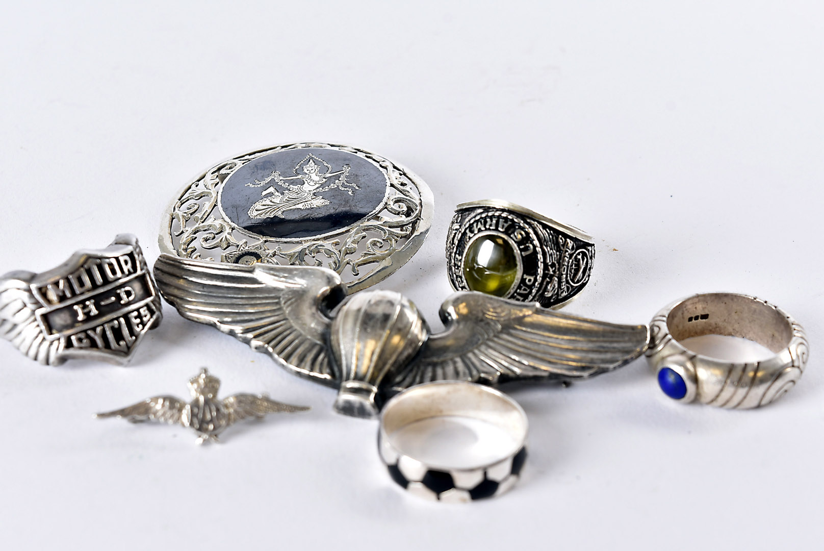 Seven silver and white metal items of jewellery, including a US Paratrooper / Marine style brooch